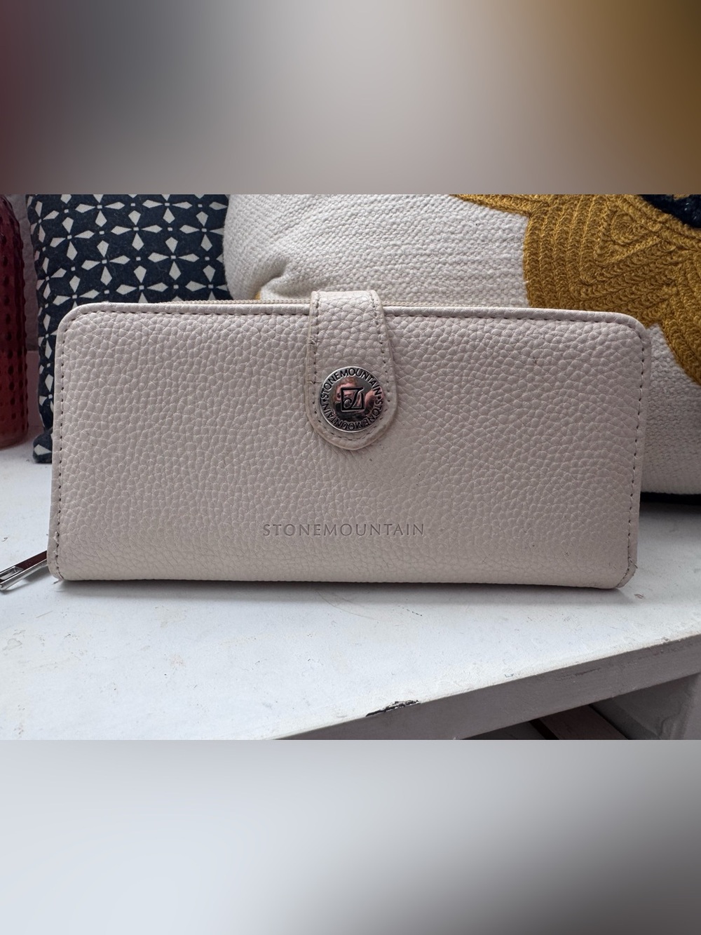 Stone mountain cream colored pebbled leather zip around wallet